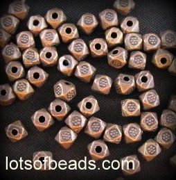 Copper faceted stamped flower bead